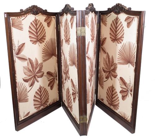 A late 19th century French four-fold mahogany draught screen with acanthus carved arch top, later leaf decorated panels, 360cm wide x 150cm high. Prov