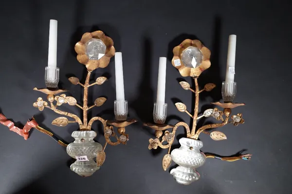 A pair of Maison Bagues style gilt metal and crystal two branch wall lights, each formed as a flowering plant, 41cm high. (2) Provenance; property fro