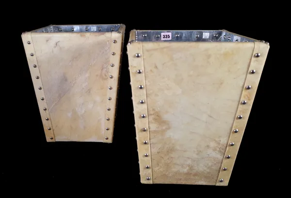 A pair of modern cow hide covered waste bins, each of square tapering form with studded decoration, 39cm high and a white painted rectangular wooden s