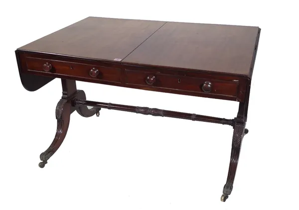 A Regency mahogany sofa table, with two drawers on dual standard supports, 113cm wide x 76cm deep x 71cm high. Provenance; property from the late Sir