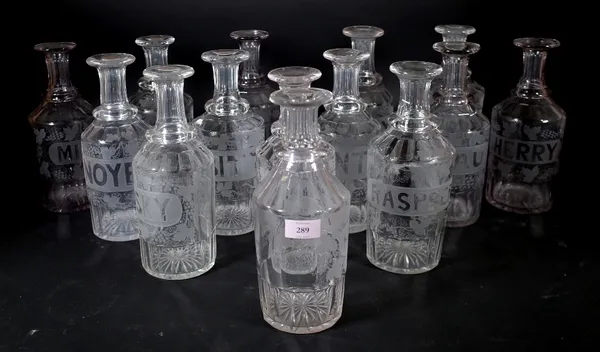 Fourteen Victorian engraved decanters, (lacking stoppers) variously titled; Whisky, Mint, Brandy, Hollands & others, 27cm high. (14) Provenance; prope