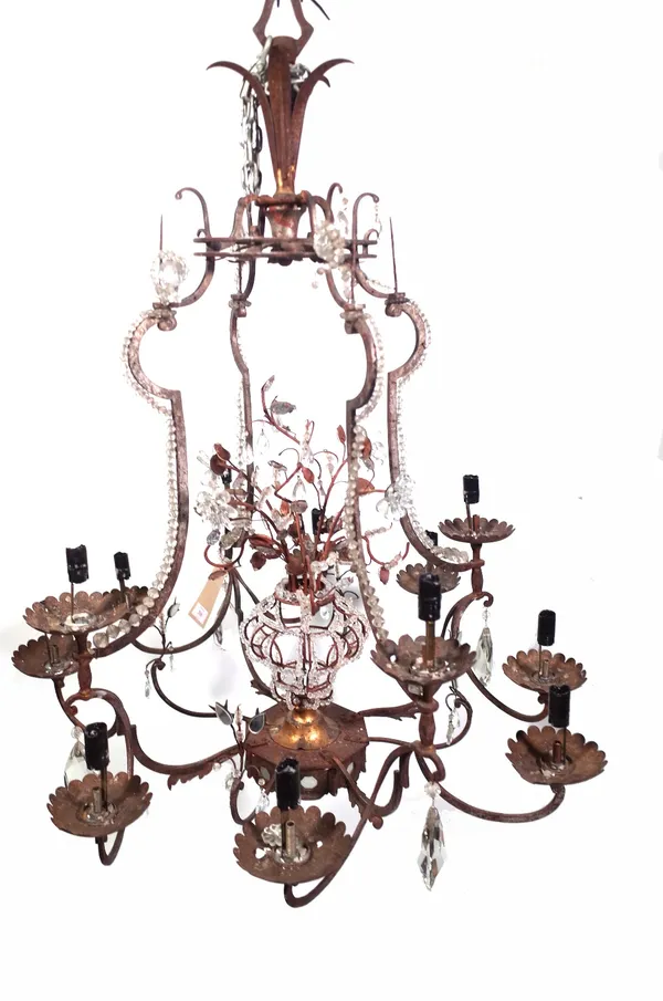 A modern gilt metal and glass twelve branch chandelier of shaped open cage form with central internal 'vase of flowers', the branches arranged over tw