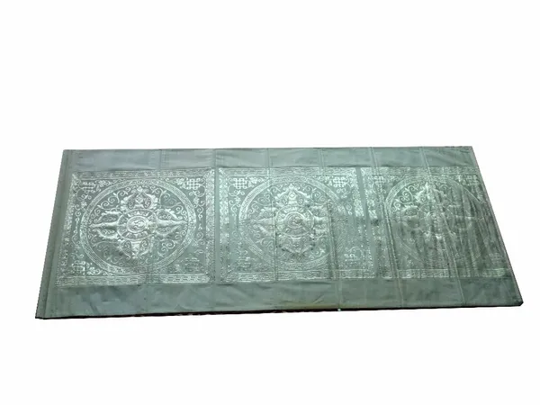 A modern Asian silkworm hanging tapestry, of rectangular form with three mandala woven designs in silver coloured thread, 226cm long x 98cm wide. Prov