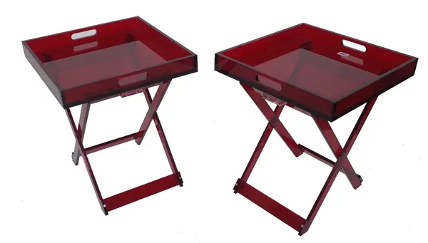 'Shanghai Tang'; a pair of red acrylic folding occasional tables, with galleried tops, 40cm wide x 46cm high. (2) Provenance; property from the late S