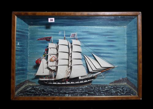 A pair of Black Forest type painted papier mache stag heads, each mounted on a wooden shield, 42cm high, a polychrome painted metal jockey figure and