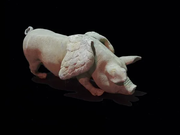 A modern lead model of a winged pig, (a.f.), 65cm wide.  Provenance; property from the late Sir David TangThis lot has been imported from outside the