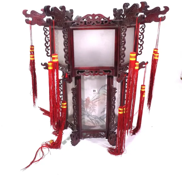 A modern Chinese hanging lantern with carved hardwood octagonal frame, glass panels and silk shades beneath, 75cm high x 80cm wide.  Provenance; prope