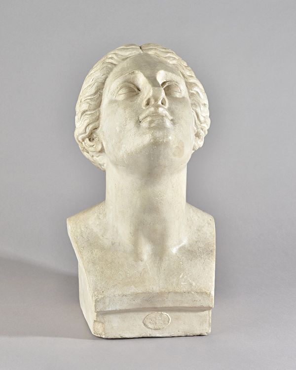 A Continental plaster bust of a woman, circa 1920, titled in pencil 'Catherine', with Paris stamp. 48cm high.  Provenance; property from the late Sir
