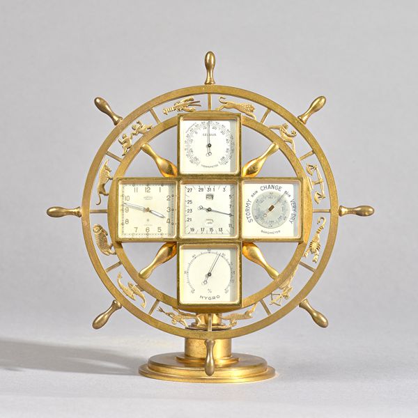 A SWISS BRASS EIGHT-DAY MANTEL COMPENDIUM TIMEPIECEAngelus, circa 1970Formed as a ship's wheel with signs of the zodiac, enclosing five square silvere