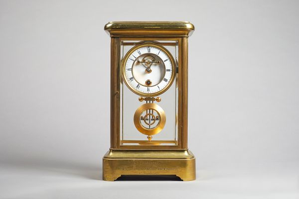 A rare and unusual French gilt-brass four glass year-going timepieceCirca 1870The case of usual form and good proportion, with bevelled glass panels,