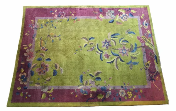 A Chinese carpet, circa 1950, olive green main field with polychrome pheasant decoration within plum border. 255cm x 262cm  Provenance; property from