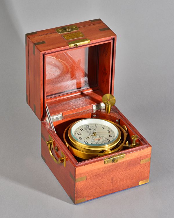 A RUSSIAN BRASS-BOUND STAINED BEECH MARINE CHRONOMETERNo 12889, circa 1985The three-piece case with top hinged cover, above a glazed observation panel