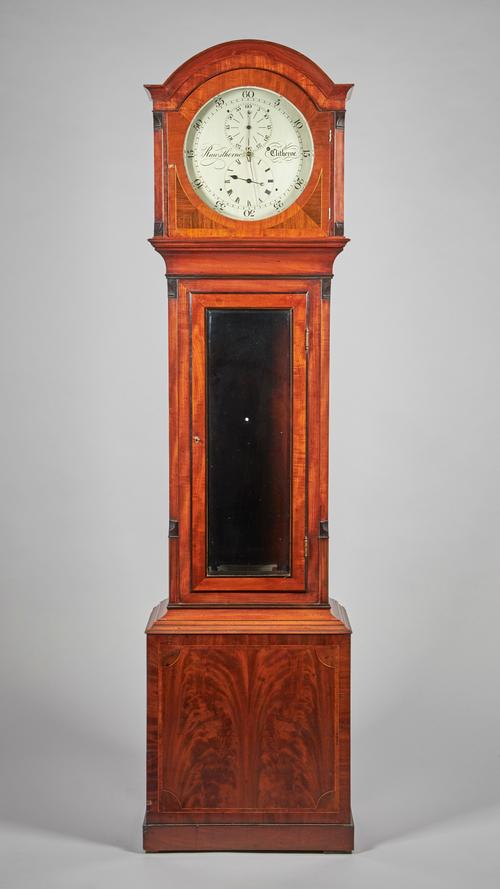 A mahogany Regulator By Rawsthorne, Clitheroe Circa 1845The arched pediment surmounted by three brass finials above the 12in. silvered circular dial w