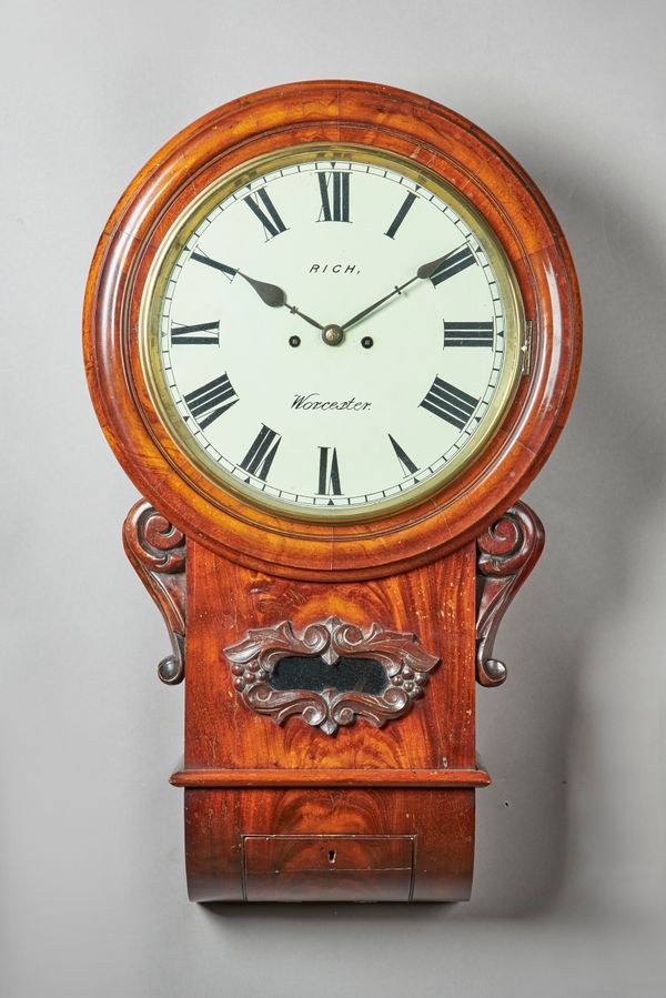 A VICTORIAN MAHOGANY DROP DIAL STRIKING WALL CLOCKThe case with a moulded circular dial surround, above a drop, centred with a glazed aperture within