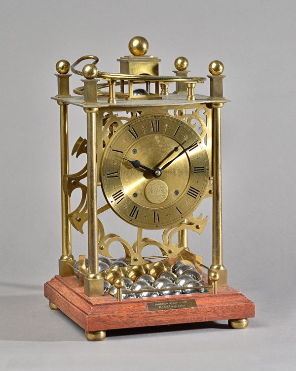 A SPHERICAL WEIGHT TIMEPIECEBy Harding & Bazeley, Cheltenham, No. 527/1,000, September 1980Formed with four turned uprights, the ball 'reservoir' abov