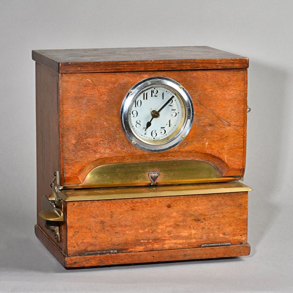 AN ENGLISH WALNUT CASED 'CLOCKING-IN' TIMEPIECEProbably by The National Time Recorder Co. Ltd., circa 1950In a rectangular case with lift-up lid and h