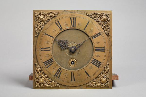 A George I longcase timepiece movementBy Thomas Wightman, LondonThe 11in. square brass dial with pierced cherub head and foliate cast spandrels, the c