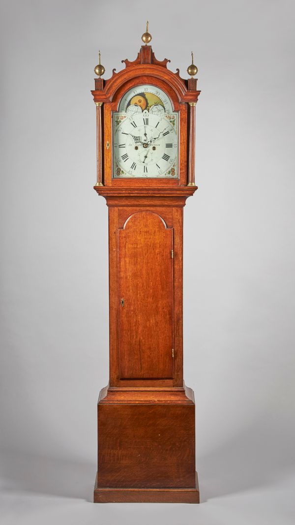 A GEORGE III OAK LONGCASE CLOCKBy John Payne, Lenham, circa 1780The case with an arched pediment and fretted cornice, above a glazed door, with a flut