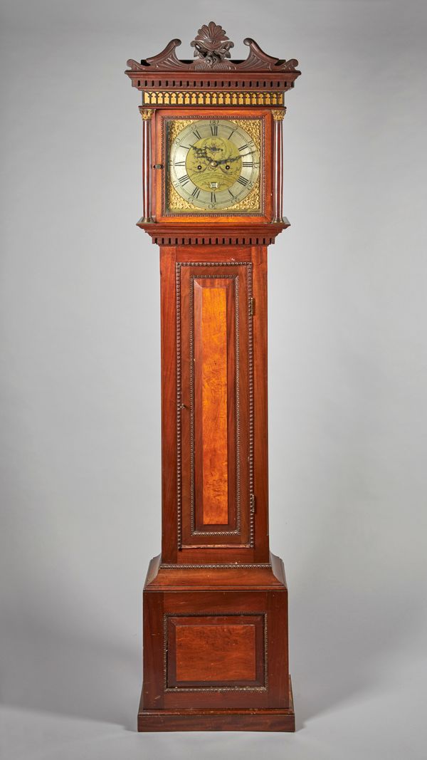 A WALNUT AND OAK LONGCASE CLOCKThe associated movement by Thomas William Lutwych, WorcesterThe case with a swan-neck pediment centred by foliage, abov