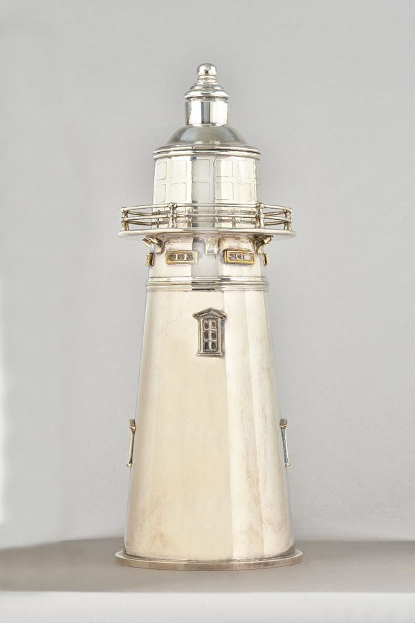 B H & S, a modern silver plated novelty cocktail shaker, formed as a lighthouse, 35cm tall.Provenance; property from the late Sir David TangThis lot h