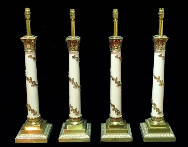 A set of four 20th century brass Corinthian column table lamps, with acanthus moulded decoration and scrolling fruit columns, 75cm high. (4)  Provenan