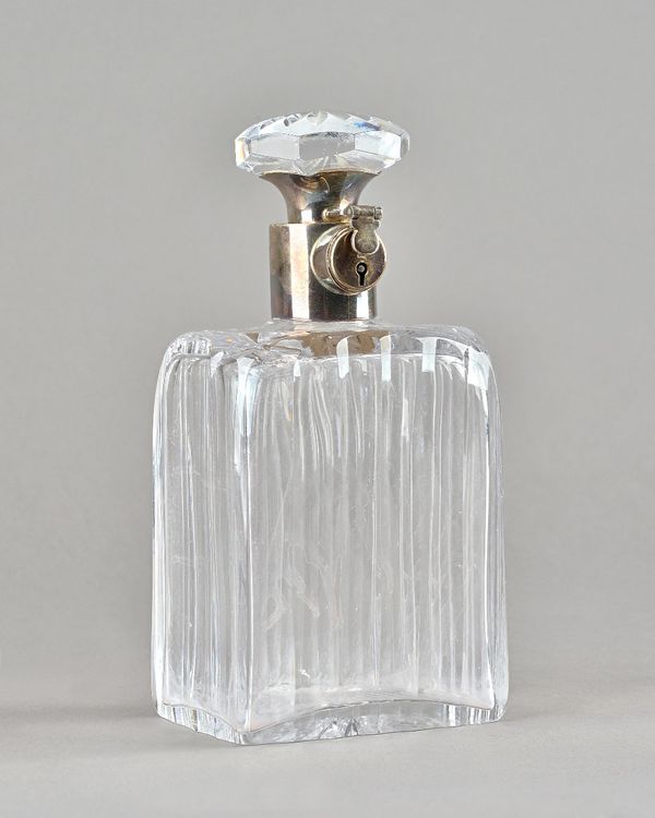 A George V silver mounted cut glass lockable decanter, (lacking key), by Hukin and Heath, Birmingham 1935.  Provenance; property from the late Sir Dav
