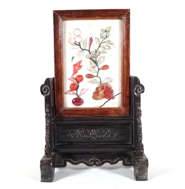 An early 20th century Chinese hardwood table screen, pre-1918, with hardstone inlaid plaque, 17cm wide x 27cm high.  Provenance; property from the lat