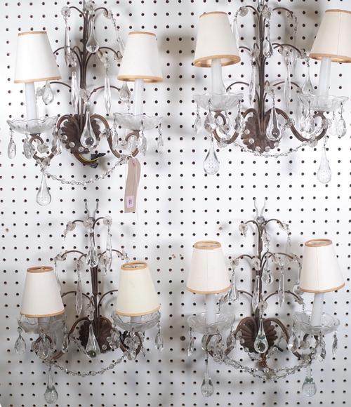 A set of four metal twin branch wall lights, each swan neck branch united by glass beads and hung all over with glass drops, 30cm high. (4)   Provenan