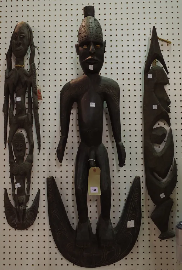 Tribal interest; Three Sepik river carved wooden food hooks, the largest 92cm.