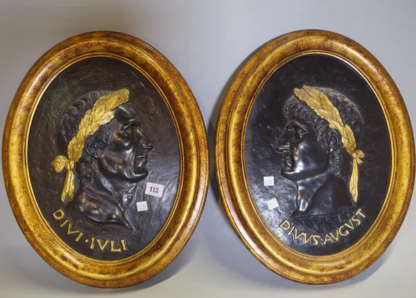 A pair of modern giltwood oval panels, each relief carved with Roman male busts with Latin gilt title beneath, 48.5cm high, (2).