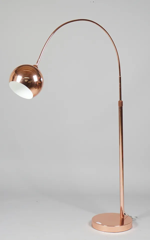 A 1970s style adjustable copper coloured floor light, a matching table lamp with shade and a 1960s style wall clock, (3).