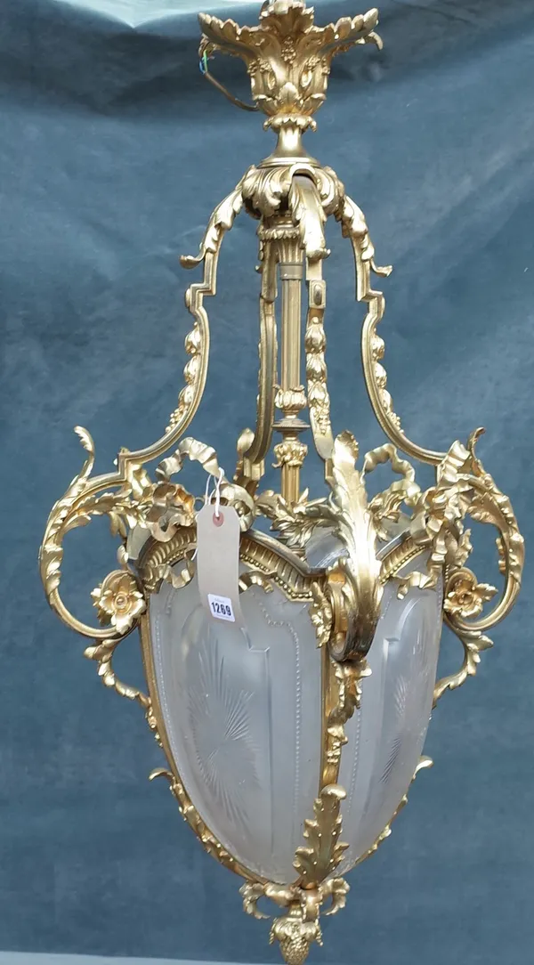 A French ormolu and frosted glass hall lantern, ovoid shaped in the Louis XVI style, 90cm high.