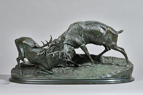 After Pierre Jules Mene, (French 1810-1879) a bronze group of rutting stags, signed to the cast 'P.J. Mene', 58cm wide. Illustrated
