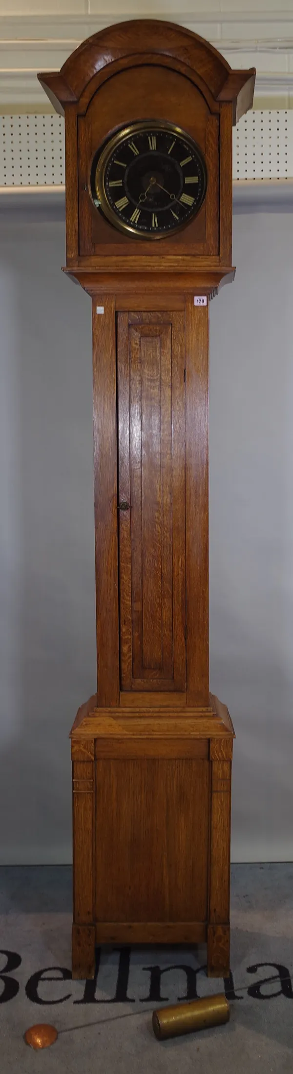 A 20th century oak longcase clock with black painted dial, 43cm wide x 230cm high, 1 x pendulum & 1 x weight.