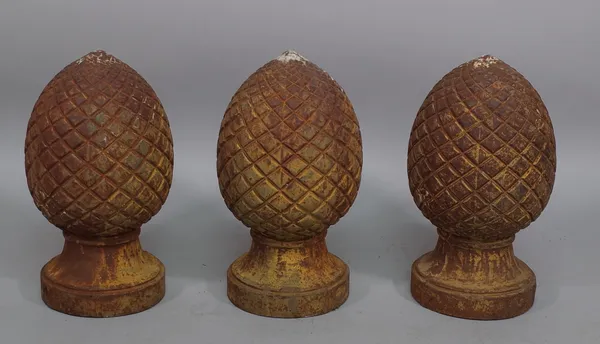 A set of three cast iron pineapple pier finials, 47cm high, (3).