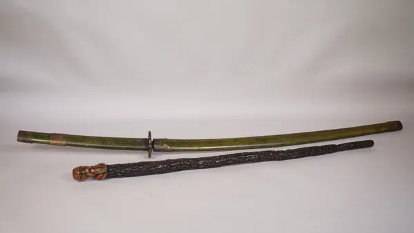 A South East Asian hardwood walking stick, the finial carved as the head of a sage, 82cm and a Japanese Katana sword in a faux shagreen scabbard, blad