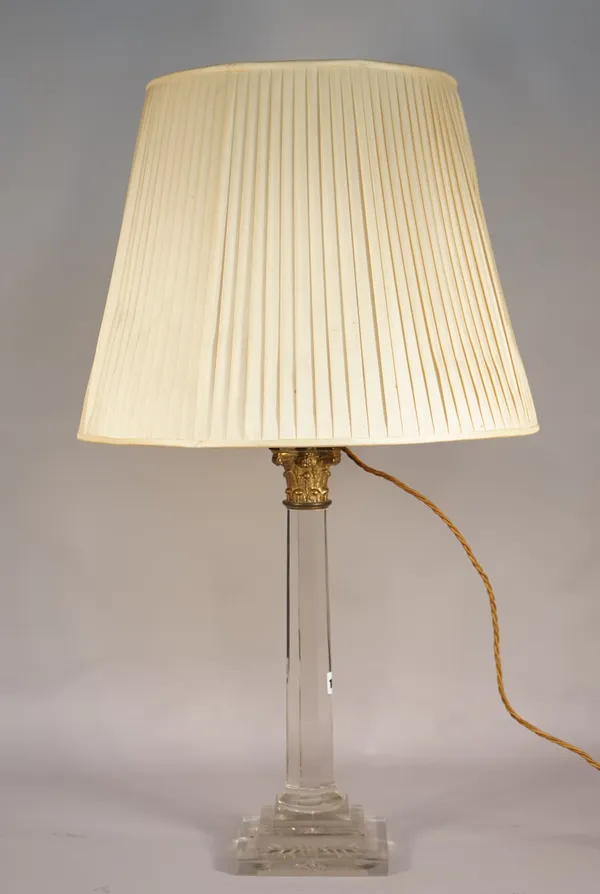 A modern perspex and gilt metal mounted table lamp of Corinthian column form, with a pleated cream shade, 77cm high overall.