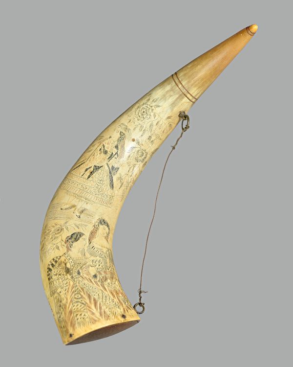 A mid-19th century scrimshaw cow horn detailed in black and brown inks, with three female figures, within a foliate border, 35.5cm. Illustrated