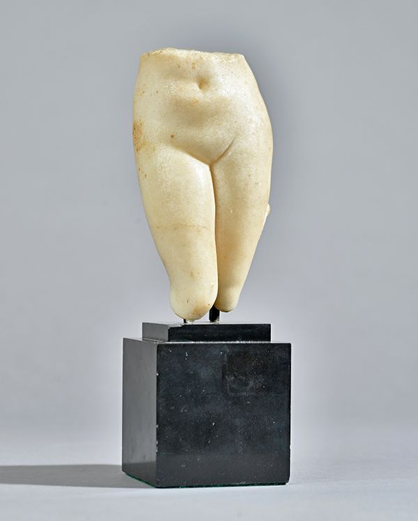 A Greco-Roman marble lower torso of Aphrodite, circa 1st Century A.D. standing with weight on her left leg, her right leg bent forwards at the knee, t