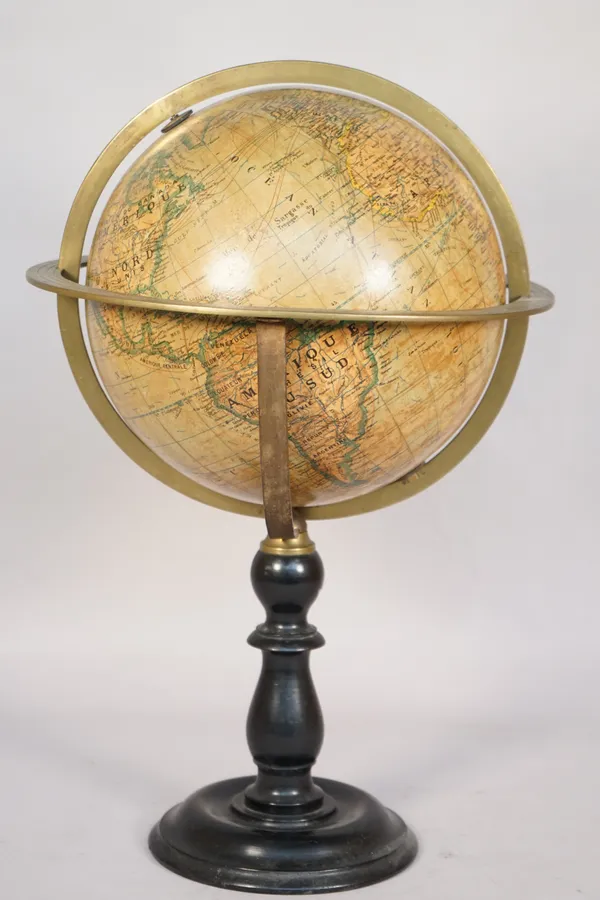 A French nine inch 'Ikelmer' world globe on a turned ebonised wooden stand, 48cm high.