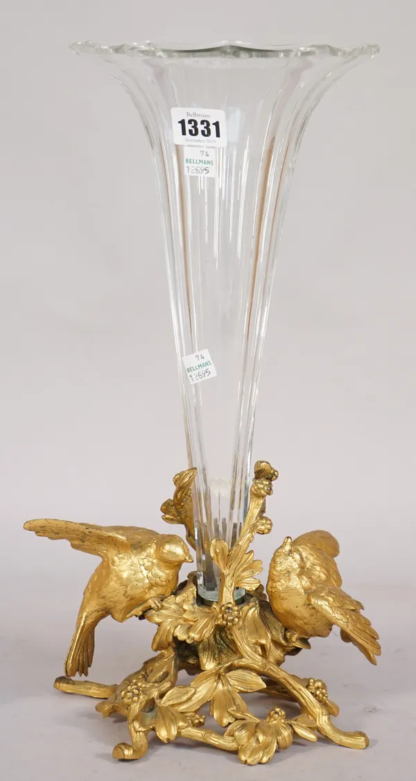 A French ormolu mounted glass vase, circa 1880, the clear trumpet shaped bowl supported on a bird cast foliate base, 39.5cm high.