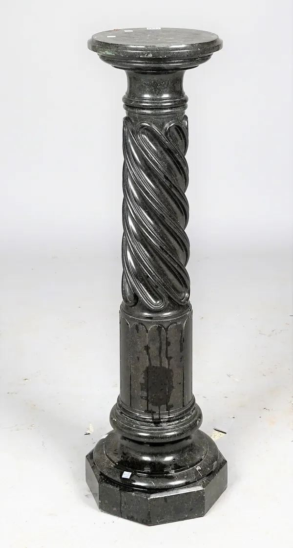 A verde marble pedestal with spiral carved fluted body, 108cm high.