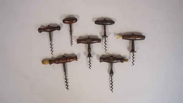 A 19th century straight pull corkscrew, with turned rosewood handle and brush, the steel shaft stamped 'MM' with wire helix and six further similar co