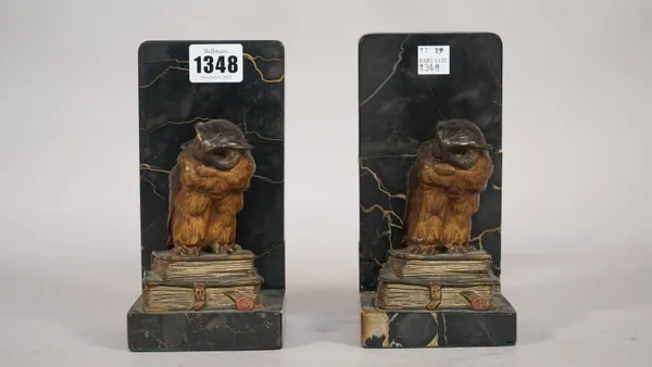 A pair of Austrian cold painted bronze 'owl' bookends, early 20th century, each mounted on a marble base, owls 10.5cm high, (a.f.) (2).