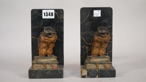 A pair of Austrian cold painted bronze 'owl' bookends, early 20th century, each mounted on a marble base, owls 10.5cm high, (a.f.) (2).