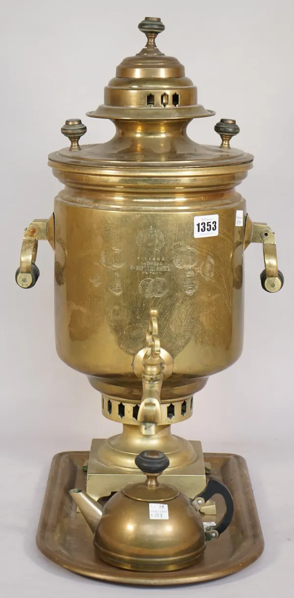 A Russian brass samovar, circa 1900, with twin handles over a square foot and four shaped feet, with a teapot and tray, samovar 35cm high.