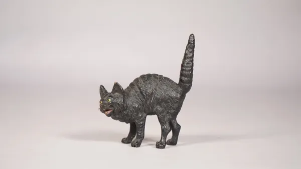 An Austrian cold-painted bronze cat, early 20th century, modelled in an aggresive standing pose, unsigned, 9.5cm high.