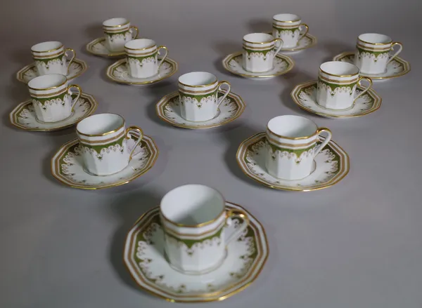 A modern Limoges gilt and green coffee set, retailed by Asprey, comprising twelve cups and twelve saucers.