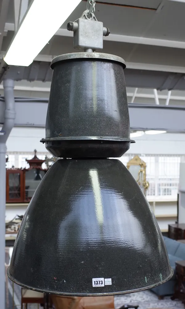 Four industrial light fitments, mid/late 20th century, grey enamelled sheet metal of sectional circular tapering form, 70cm high, (4).