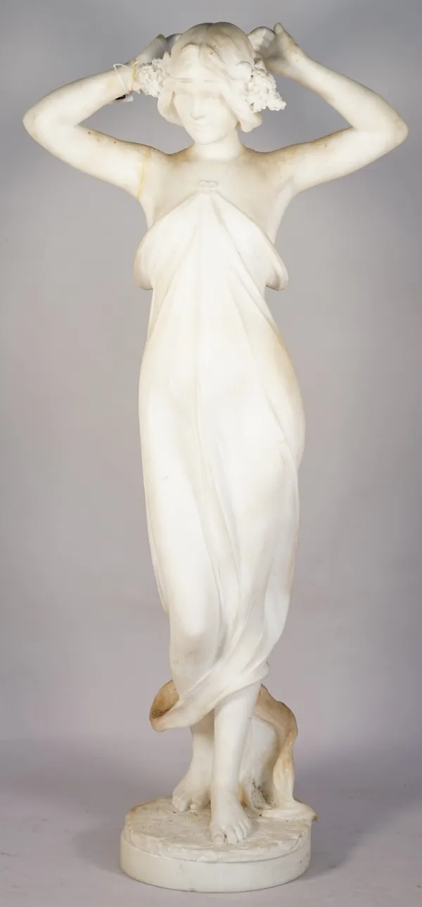 An Italian marble figure, late 19th century, Art Nouveau female standing, arms raised above her head, the plinth base, signed 'C.Pittaluga Firenze', 7